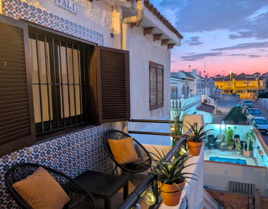 Evening terrace - Apartment Vali Torrevieja Cozy evening terrace with chairs, plants and sunset view at Apartment Vali Torrevieja